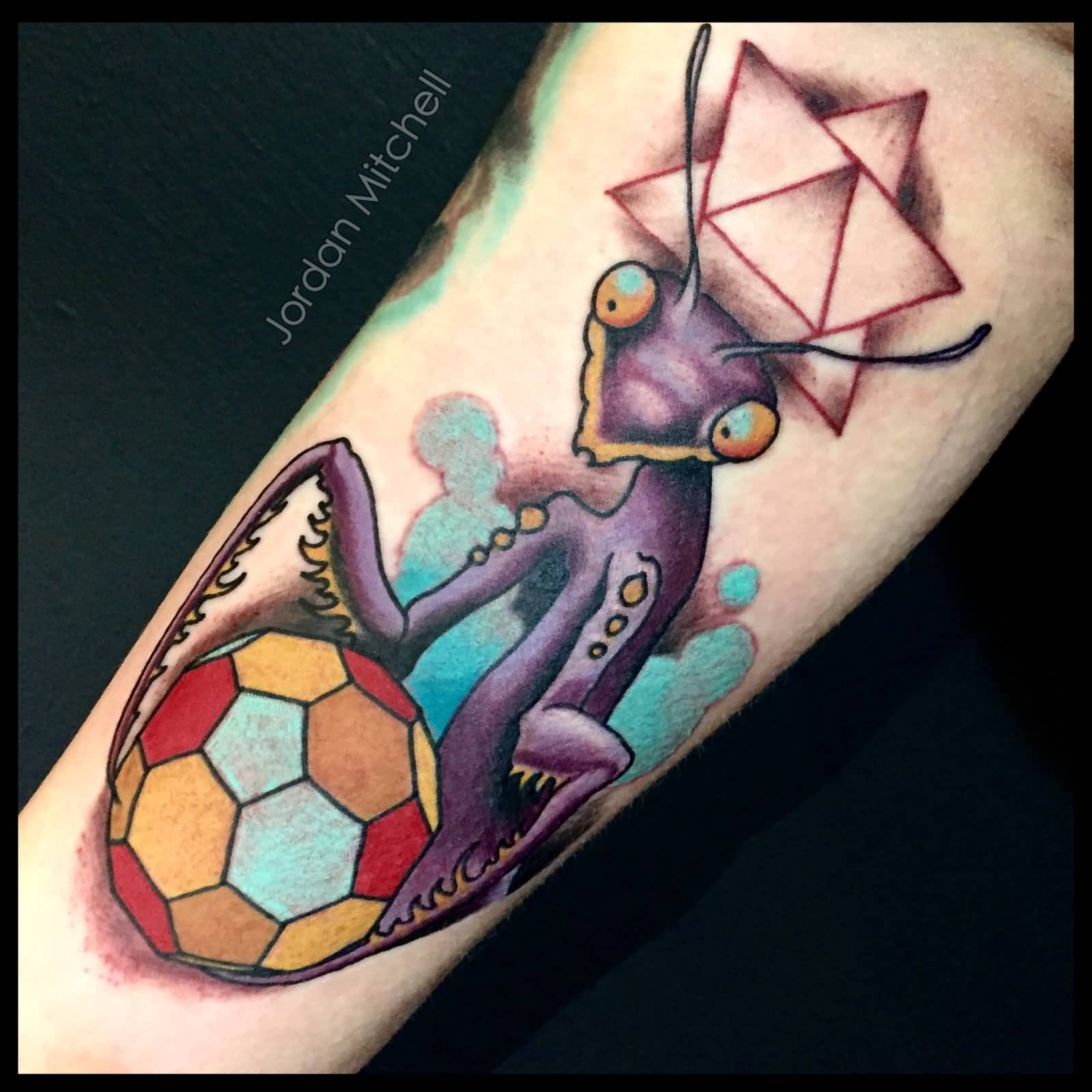 Mantis With Football Tattoo On Forearm