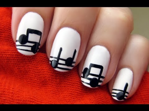 Matte White Base Nails With Black Musical Notes Nail Art Design