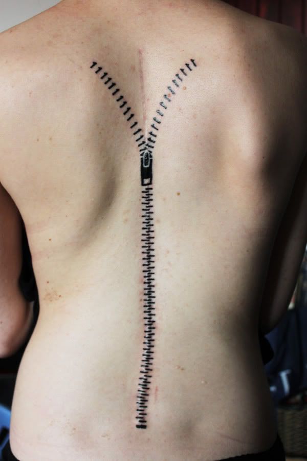 Nice Black Little Open Zipper Tattoo On Spine Chord