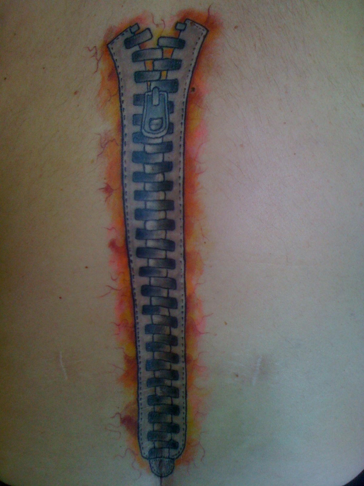 Nice Colored Zipper Tattoo By Roman Abrego