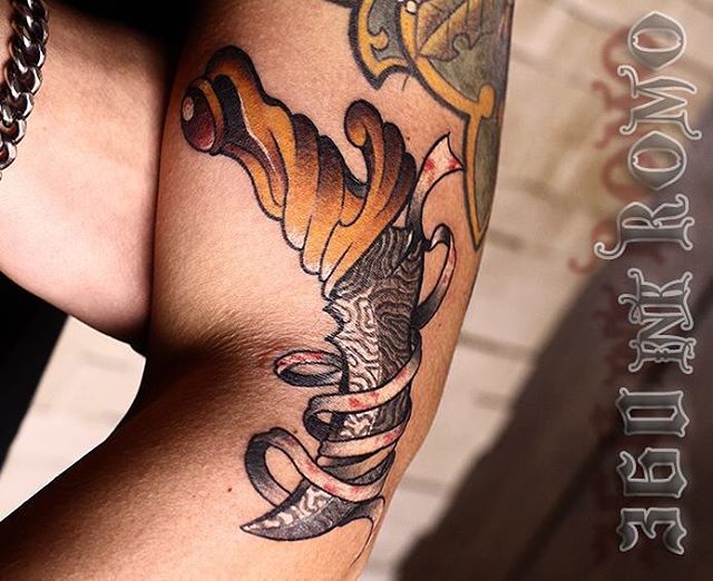 Nice Dagger Knife And Banner Tattoo On Arm