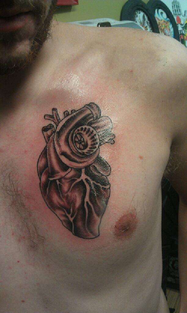 Nice Grey Heart And Turbo Tattoo On Chest For Men