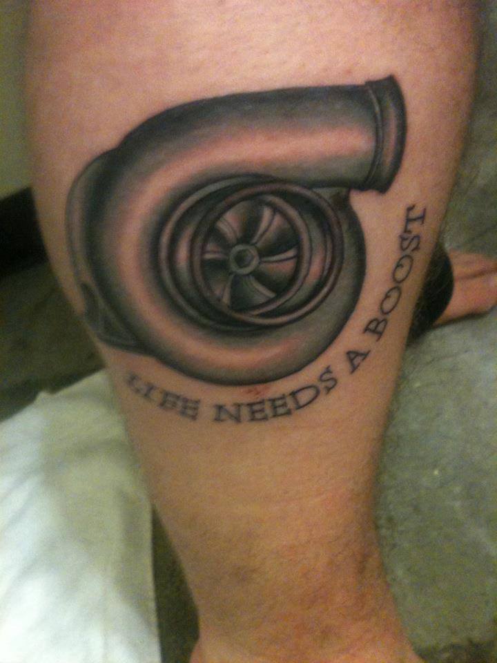 Nice Grey Ink Turbo With Lettering Tattoo On Leg