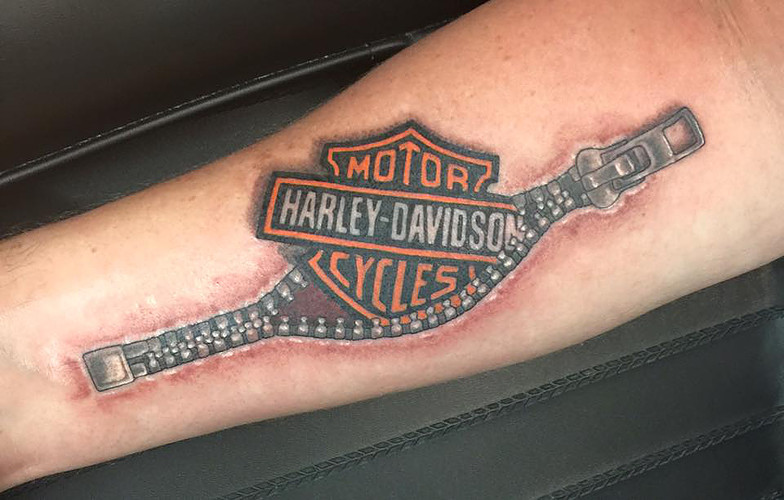 Nice Harley Davidson Bike Logo Zipper Tattoo On Forearm