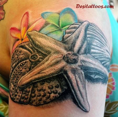 Nice Starfish With Seashell And Flowers Tattoo