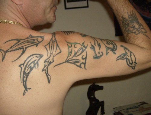 Nice Tribal Sea Creatures Tattoo On Arm And Shoulder