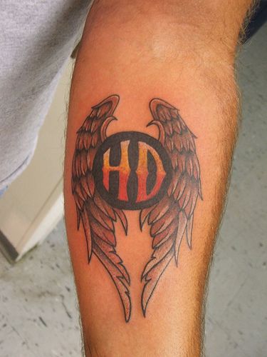 Nice Winged Harley Tattoo On Left Forearm