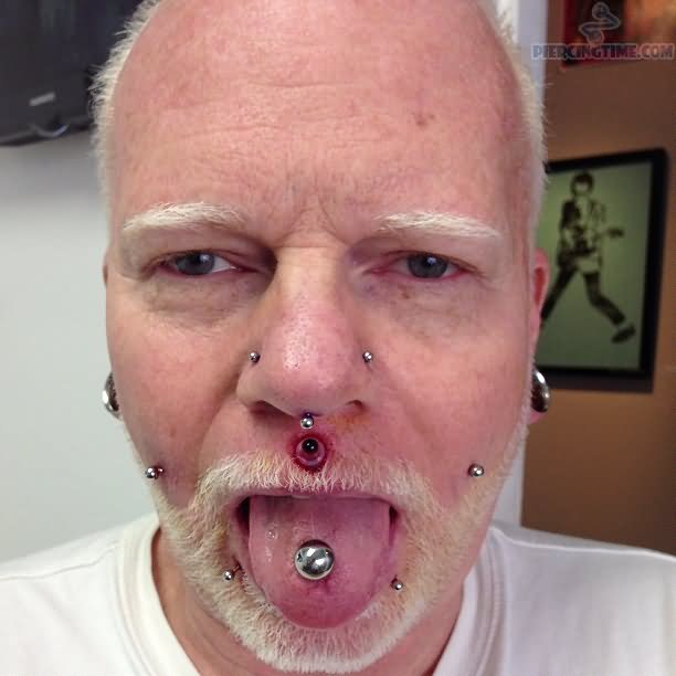 Old Man With Multiple Face And Septril Piercing