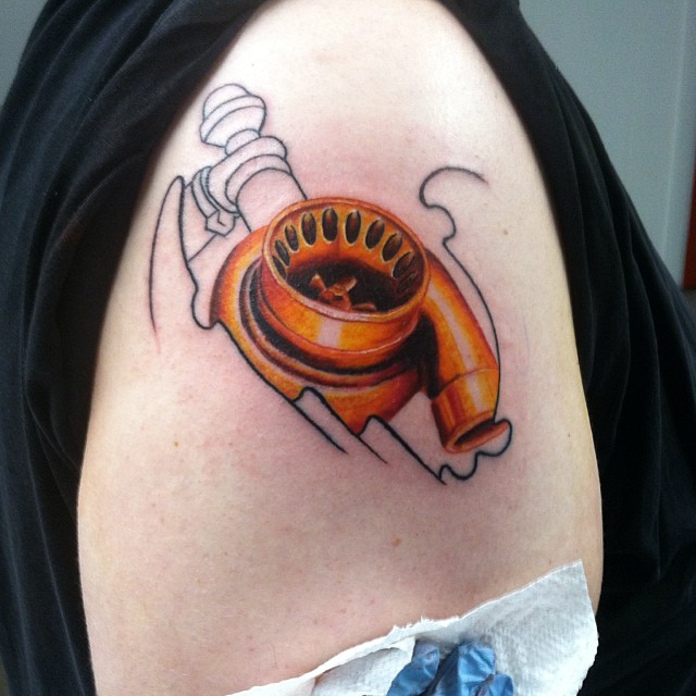 Orange Color Turbo Tattoo On Right Shoulder
