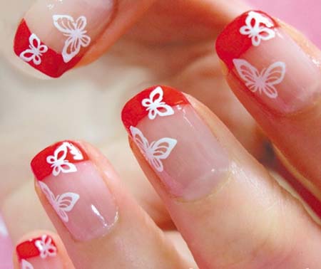 Orange Tip Nails With White Butterflies Nail Art