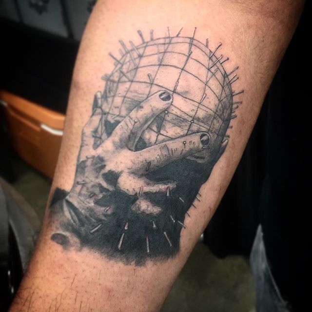 Pinhead Hiding Face Tattoo On Arm By LeftysTattoos