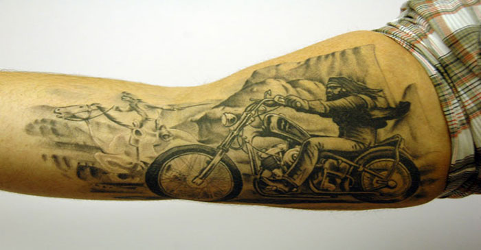 Realistic Harley Bike And Mountains Tattoo On Arm