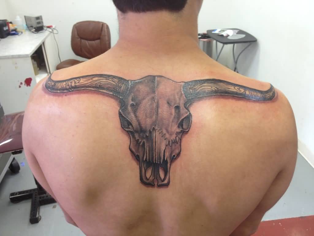Realistic Longhorn Face Tattoo On Upper Back For Men.