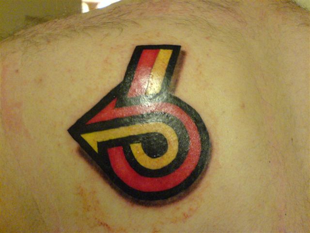 Red And Yellow Arrow In Turbo Shape Tattoo