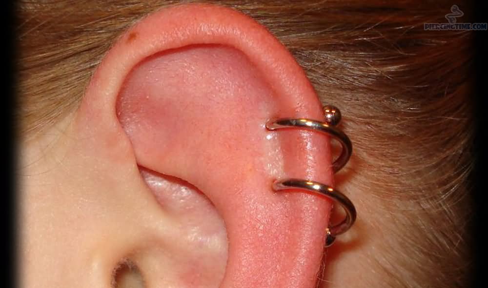 Rim Piercing With Spiral Ring On Left Ear
