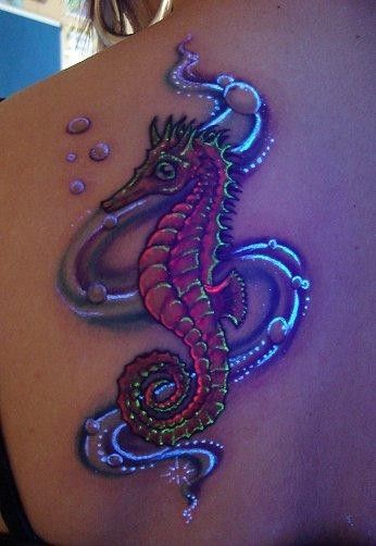 Seahorse With Blacklight Ink Tattoo On Left Back Shoulder