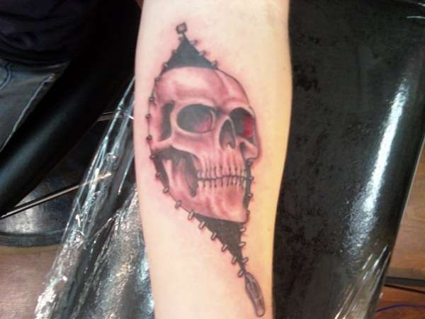 Simple 3D Skull Coming Outside From Zipper Tattoo On Forearm