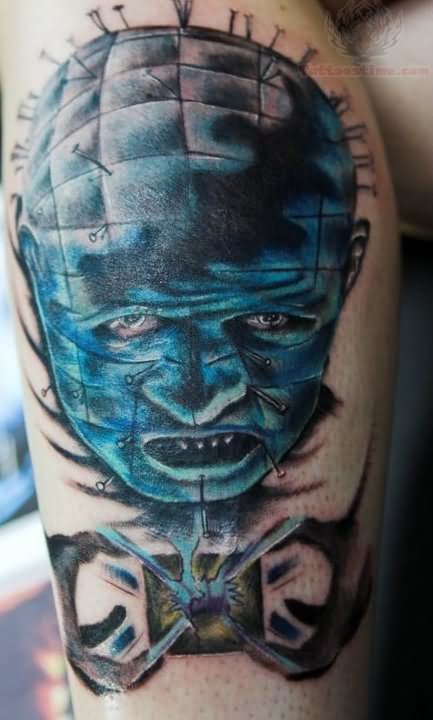 Sky Blue Ink Pinhead Face Tattoo