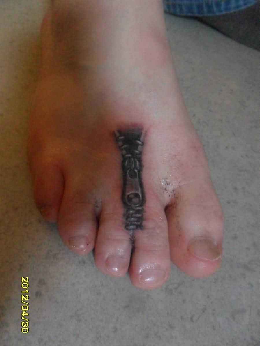 Small Black Zipper Tattoo On Foot By BadMama Tattoo