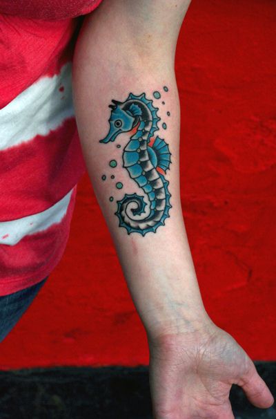 Small Colored Seahorse Tattoo On Forearm