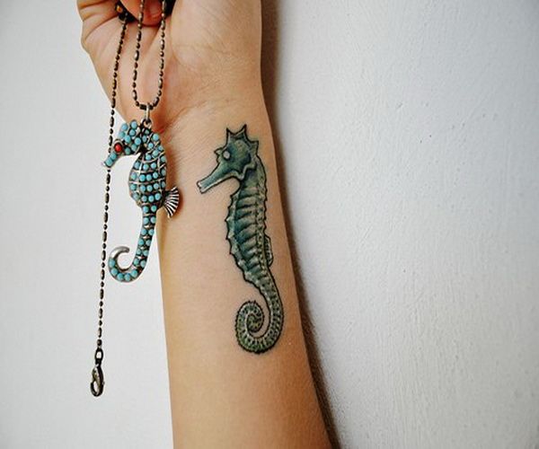 Small Green Color Seahorse Tattoo On Wrist