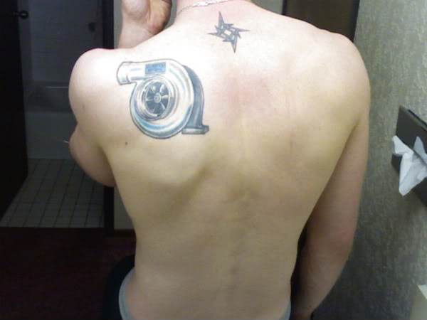 Small Turbo Charger Tattoo On Left Back Shoulder
