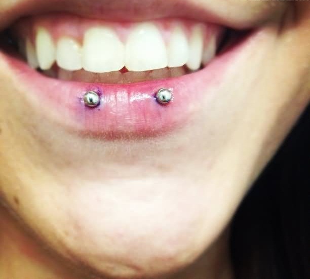 Snake Eyes Piercing With Silver Studs