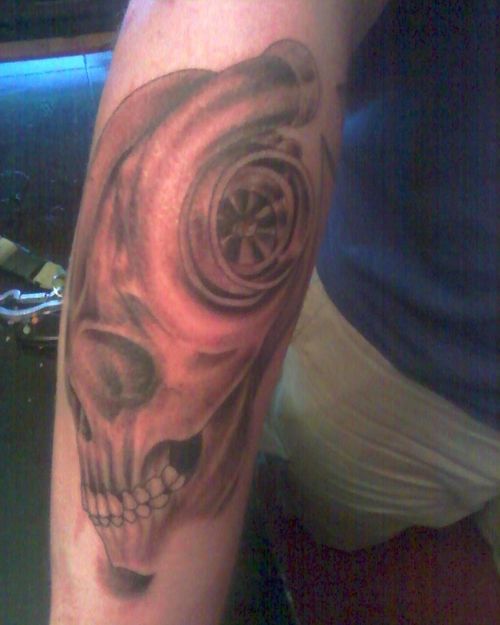 Terrific Grey Ink Turbo Skull Tattoo On Arm Sleeve