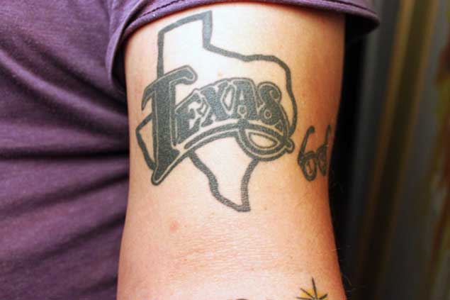Texas Word On Map Outline Tattoo On Biceps