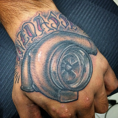 Text With Grey Turbo Tattoo On Hand