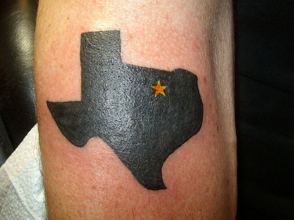 Tiny Heart In Black Texas Map Tattoo