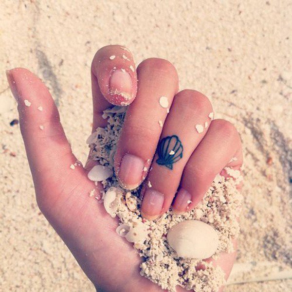 Tiny Sea Creature Seashell Tattoo On Finger