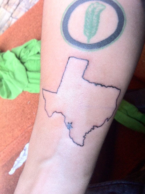 Tiny Star In Texas Map Outline Tattoo On Forearm