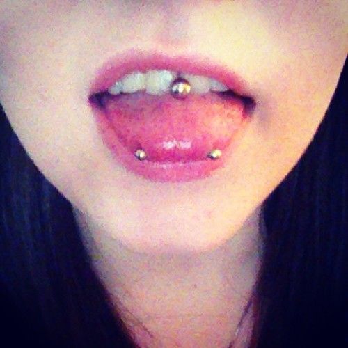 Tongue And Snake Eyes Piercings
