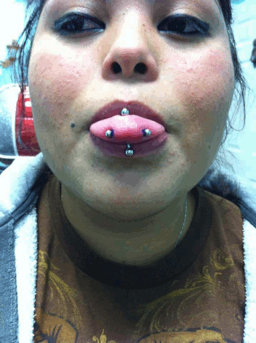 Tongue Piercing And Snake Eyes Piercing For Women