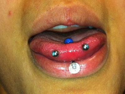 Tongue Piercing And Snake Eyes Piercing