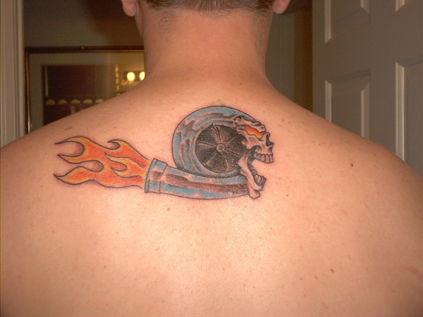 Turbo Skull With Flames Tattoo On Upper Back