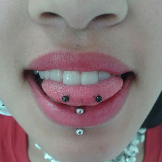 Vertical Labret And Snake Eyes Piercing With Black Barbell