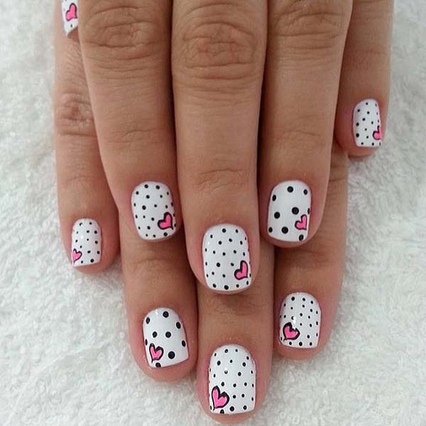White Base Nails With Black Dots And Pink Heart Design