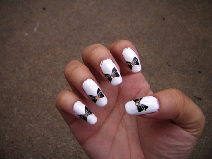 White Nails With Black Bow And Rhinestones Design Nail Art Idea