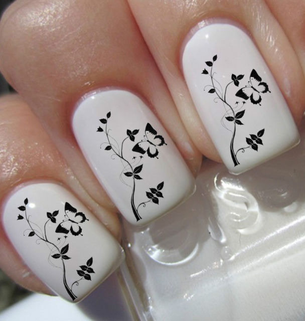 White Nails With Black Butterflies And Flowers Nail Art