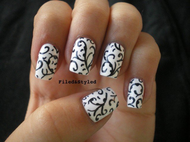 White Nails With Black Floral Design Nail Art