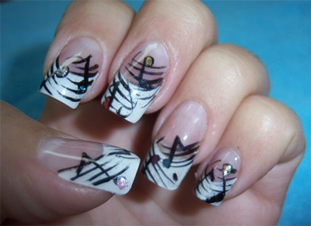 White Tip Nails With Black Music Notes And Rhinestones Nail Art