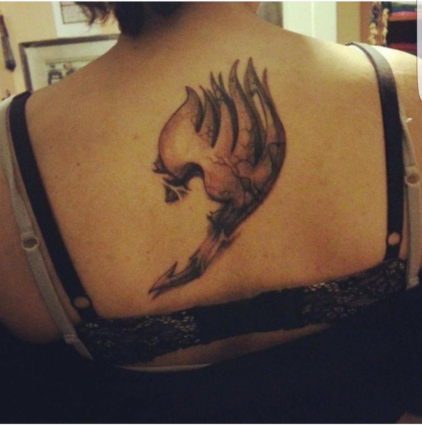 3D Grey Fairy Tail Symbol Tattoo On Upper Back For Girls