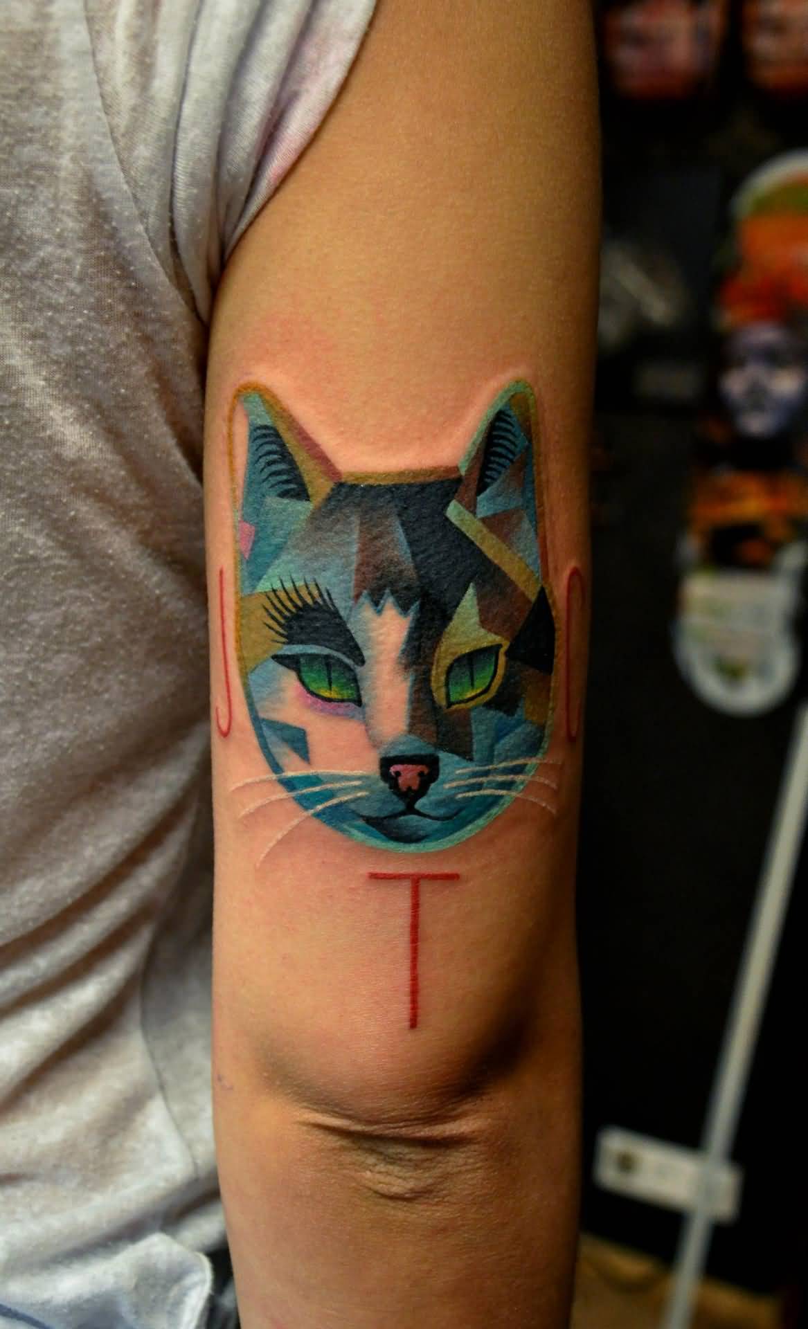 Attractive Mosaic Cat Face Tattoo On Triceps