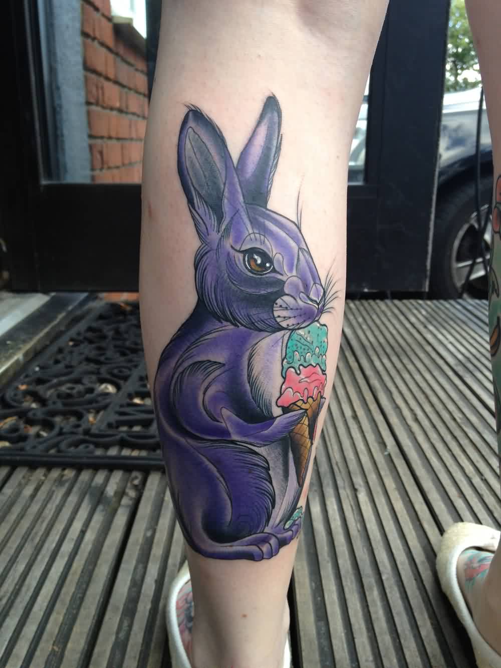 Beautiful purple Rabbit Leaking Ice Cream Tattoo On Leg