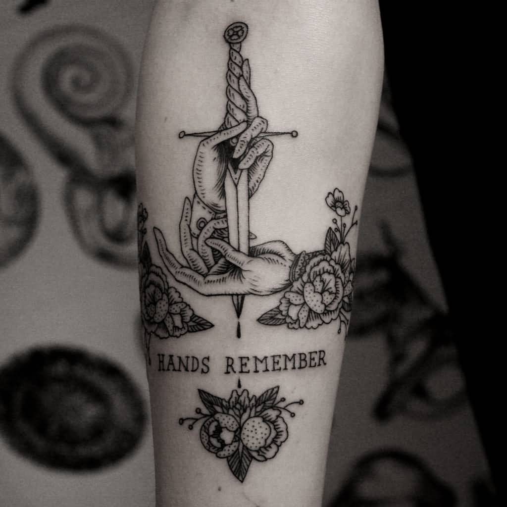 Black And White Dagger Ripped Hand Tattoo On Forearm