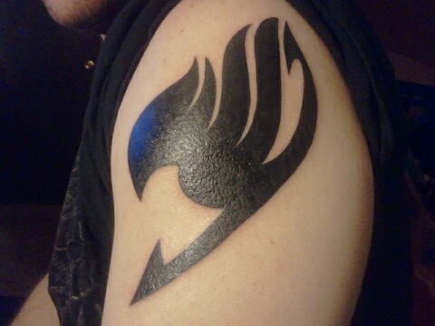 Black Color Fairy Tail Logo Tattoo On Left Shoulder