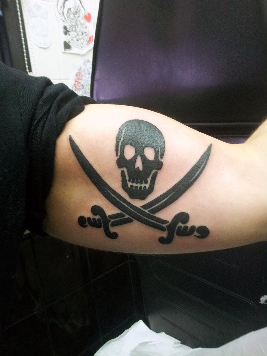 Black Jolly Roger Tattoo On Biceps By Ashtonbkeje