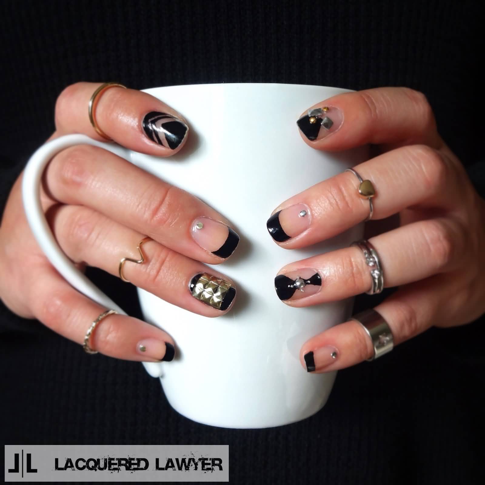 Black Negative Space Nail Art With Studs Design